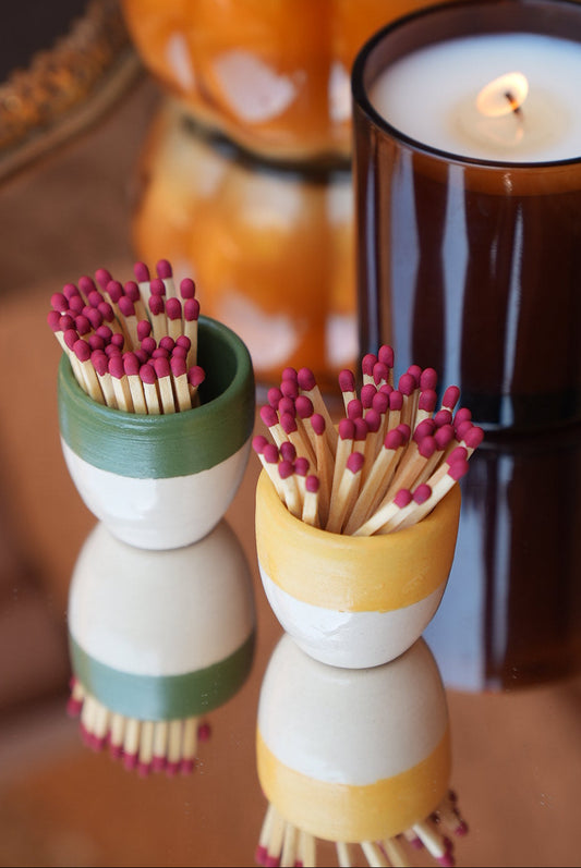  ceramic match holders in green, yellow, each filled with wooden matches
